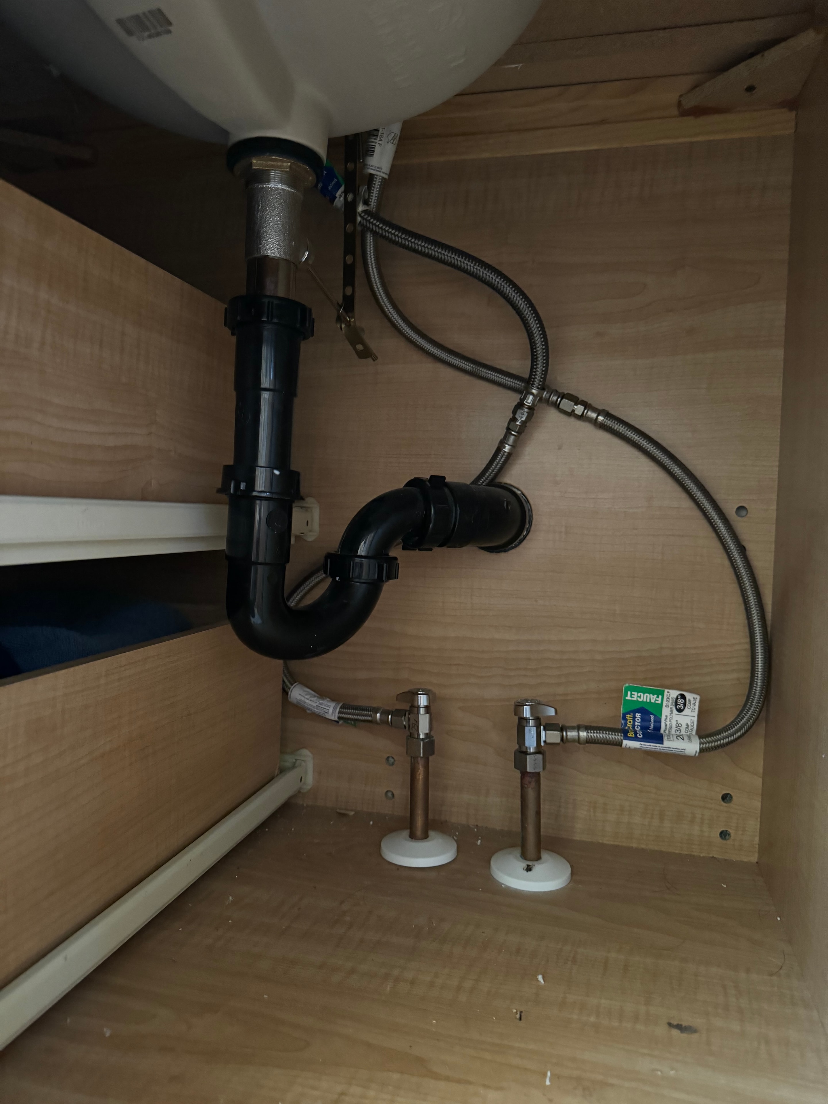 Under-sink plumbing installation by Franklee Plumbing